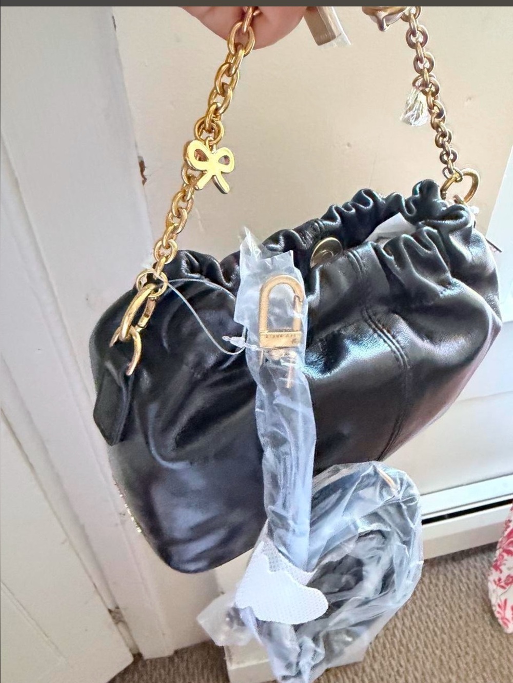 Ted Baker Black Leather Shoulder Bag with Gold Chain and Bow Charm Accent
